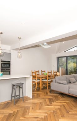 Finished open-plan kitchen with island and living area